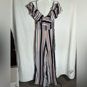 Japna Jumpsuit with flowy bodice & off the cuff shoulders zip up side. Size S